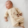 Ecru baby romper with teddy bear embroidery