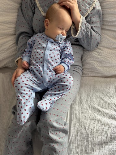 Blue baby sleepsuit with hearts and fold-over sleeves