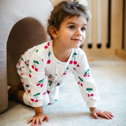 Pajac dziewczęcy bez stópek ecru w wisienki