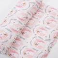 White muslin swaddle with unicorns 120x120