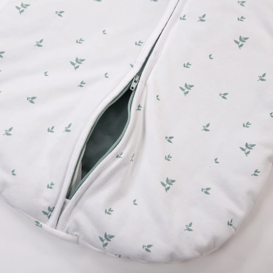 White baby sleeping bag with leaves