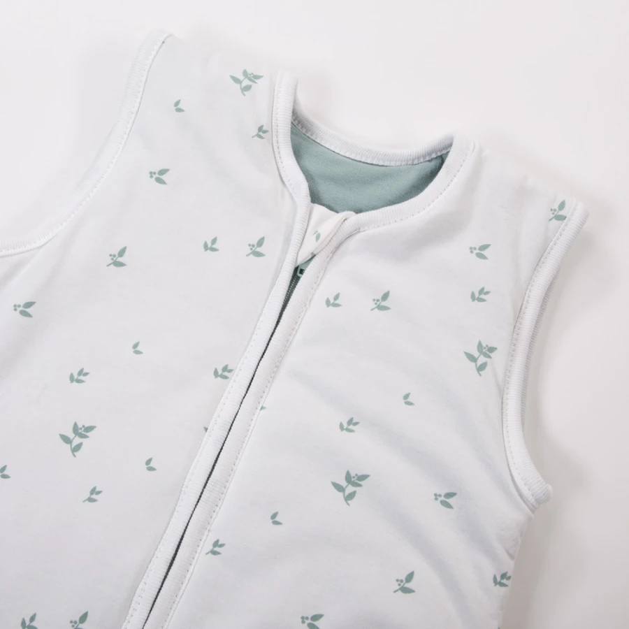 White baby sleeping bag with leaves
