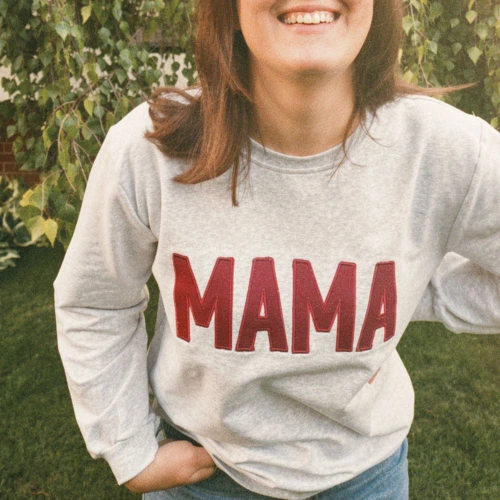 Gray sweatshirt with maroon "MAMA" embroidery