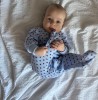 Blue baby sleepsuit with hearts and fold-over sleeves