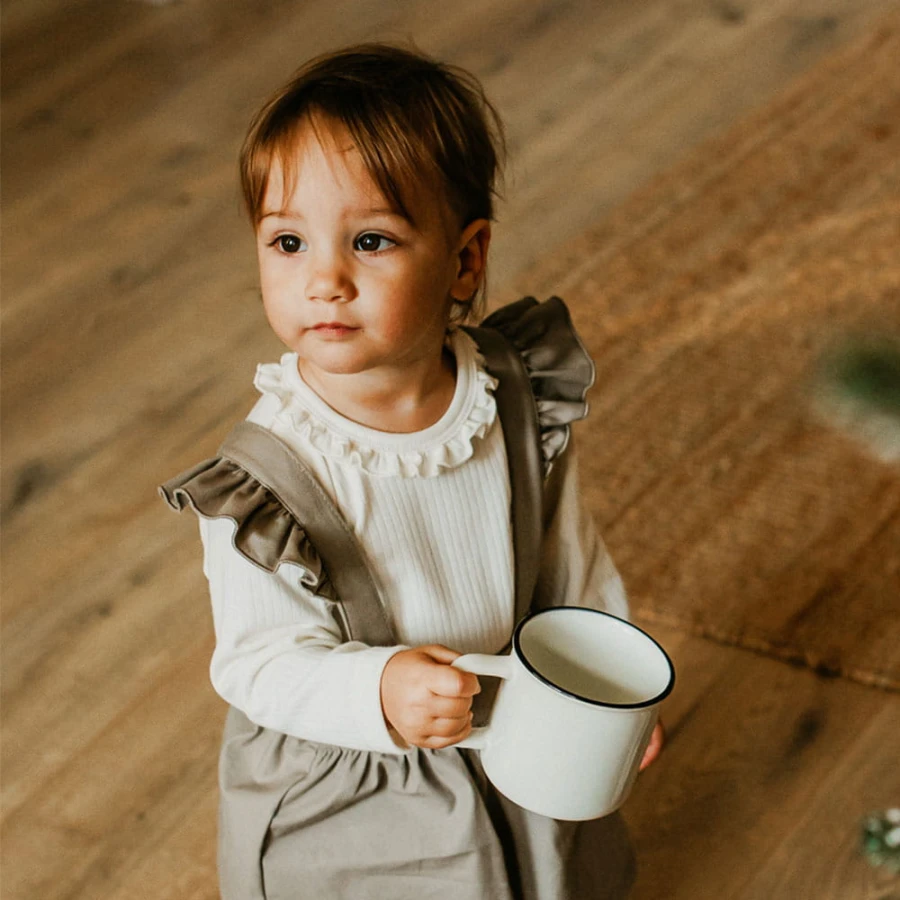 Elegant baby bodysuit with frill ecru