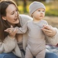 Cardigan baby body from merino wool beige